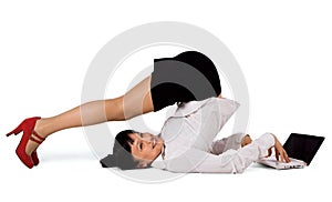 Flexible businesswoman with laptop