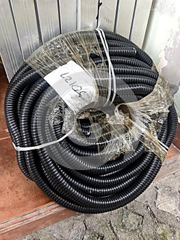 Flexible conduit coils to protect cables from weather and animals