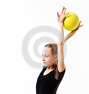 Flexible cute little girl child gymnast doing acrobatic exercise with ball isolated on a white background