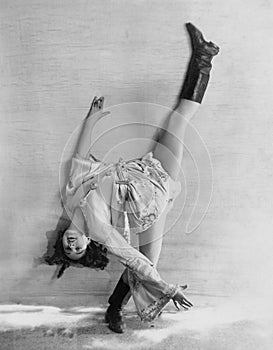 Flexible dancer bending over backwards photo