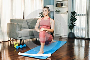 Flexible and dexterity woman in sportswear doing reverse gaiety yoga position