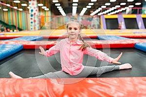 Flexible girl on playground, entertainment center