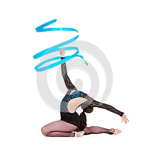 Flexible gymnast dancing with blue ribbon