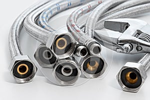 Flexible hoses. Plumbing hoses cold and warm water mixer connection to pipe tool