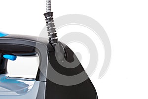 Flexible mobile cord from a new iron isolated on a white background close-up
