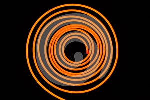 Flexible orange led tape neon flex in roll on black background