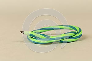 Flexible pencil on a light background. Selective focus