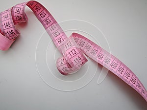 flexible pink measuring tape with millimeter grad uations
