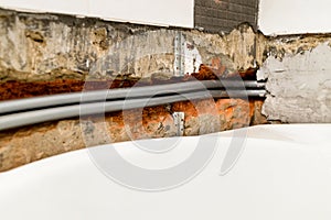flexible plumbing pipe are routed in chiseled wall photo