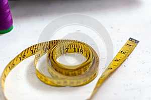 Flexible tape measure for sewing with scale in centimeters and inches