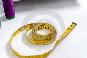 Flexible tape measure for sewing with scale in centimeters and inches