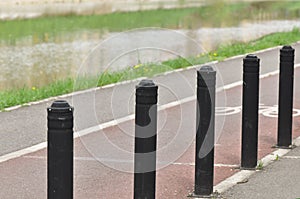 Flexible traffic bollard for bike lane.