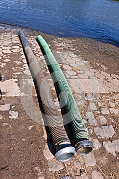 Flexible tubes for disposing liquid manure in the river