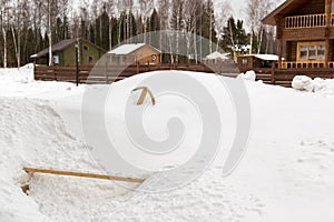 Flexible water pipe with tap sticking out of snowdrift