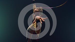Flexible woman posing camera during performance hula hoop. Sportswoman training.