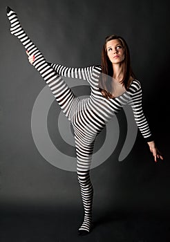 Flexible Woman in Striped Bodysuit