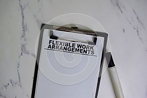 Flexible Work Arrangements write on a paperwork isolated on Wooden Table