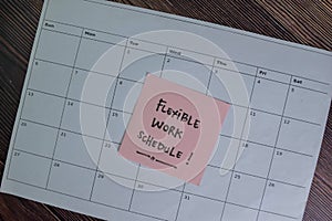 Flexible Work Schedule write on sticky notes isolated on Wooden Table