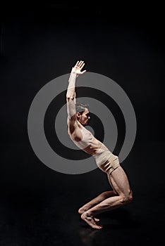 Flexible young principal dancer acting in the studio