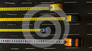 Flexometers spread on a blackboard photo