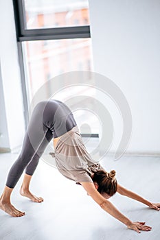 Flexsible girl practicing Ashtanga Vinyasa yoga