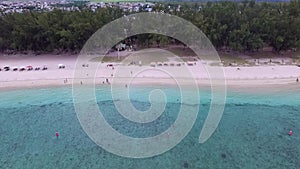 Flic en Flac Beach in Mauritius Island. Indian Ocean Coastline. Cloudy Sky and Mountain in Background IX