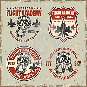 Flight academy set of vector emblems, badges, labels, logos in vintage style with grunge textures and scratches