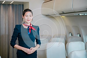 Flight attendant demonstrating the use of doors and operations on the aircraft