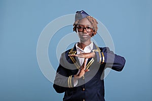 flight attendant gesturing time out and pause in studio