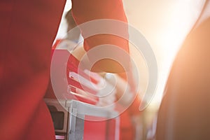 flight attendant serving food to passenger on aircraft. stewardess offer drink on board. hostess with trolley