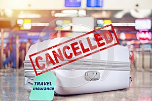 Flight cancellation concept. travel bag at the airport with travel insurance tag on suitcase holder for coverd your trip