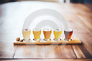 flight of craft beers on wooden sampler