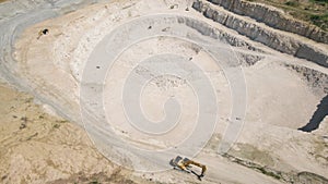 the flight of the drone over a quarry of sand and white stone