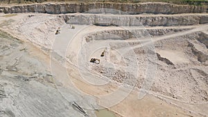 the flight of the drone over a quarry of sand and white stone,