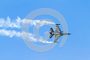 Flight of F-16 Fighting Falcon with smoke
