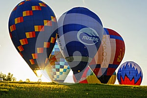 Flight of a group of hot air balloons in the summer