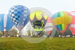 Flight of a group of hot air balloons in the summer