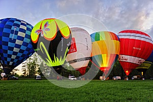 Flight of a group of hot air balloons in the summer