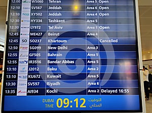 Flight information displayed on the blue colored led monitor display at the international airport. Tourists plan to travel during