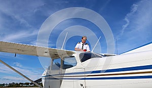 Flight in instructor fuelling aircraft before flight on a sunny day