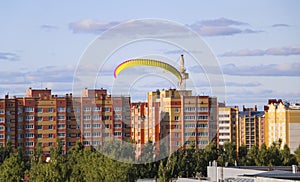 Flight of motor paraplan. a man flies on a bright colorful mot