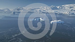 Flight over Antarctica polar ocean, snow mountain.