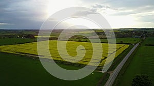 Flight over British countryside with green and yellow fields