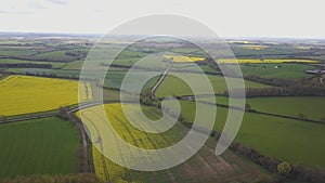 Flight over British countryside with green and yellow fields