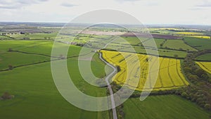 Flight over British countryside with green and yellow fields