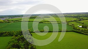 Flight over British countryside with green and yellow fields