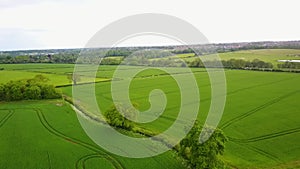 Flight over British countryside with green and yellow fields