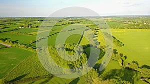 Flight over British countryside with green and yellow fields