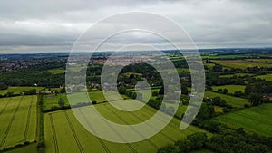 Flight over British countryside with green and yellow fields