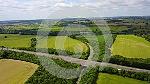 Flight over British countryside with green and yellow fields